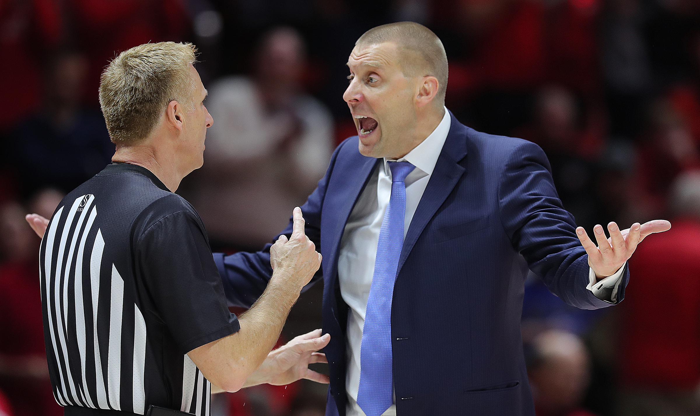 Brigham Young Cougars head coach Mark Pope argues with a referee as Utah and BYU play an NCAA basketball game at the Huntsman Center in Salt Lake City on Wednesday, Dec. 4, 2019. Utah won 102-95 in overtime.