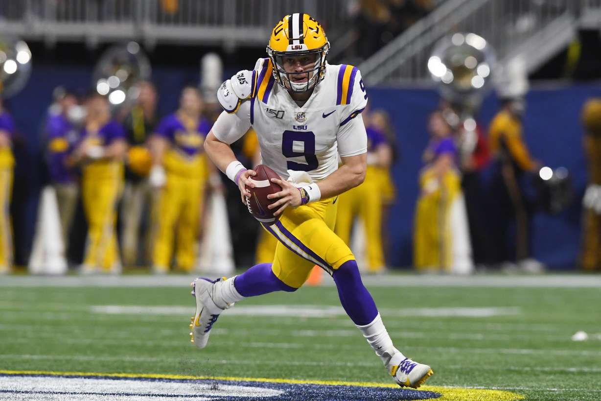 In this Dec. 7, 2019, file photo, LSU quarterback Joe Burrow (9) runs down field against Georgia during the first half of the Southeastern Conference championship NCAA college football game in Atlanta. Burrow is expected to be a first round pick at the NFL Draft on Thursday, April 23, 2020.(Photo: John Amis, AP)