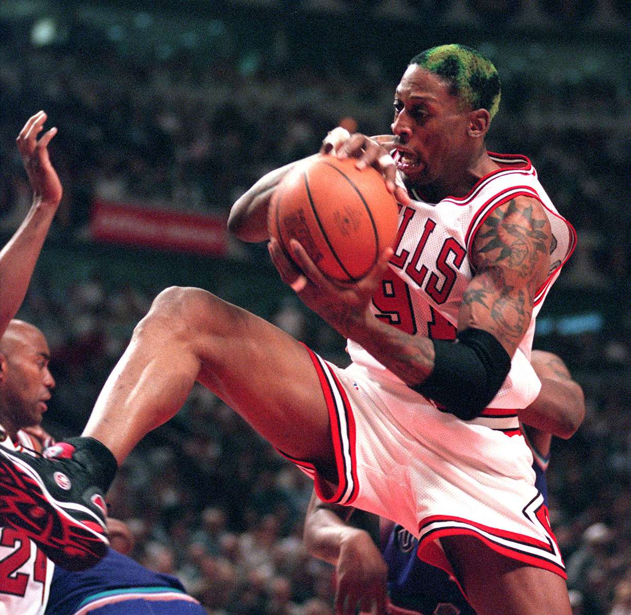 Bulls forward Dennis Rodman grabs a rebound during a loss to the Bulls in game four of the NBA Finals, June 6, 1998. (Photo: Gary McKellar, Deseret News archives)
