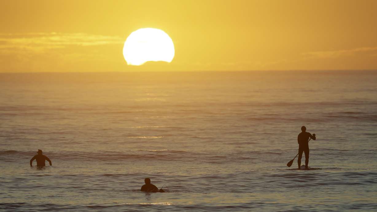 Asia Today: Surf's up, coffee's ready as New Zealand reopens