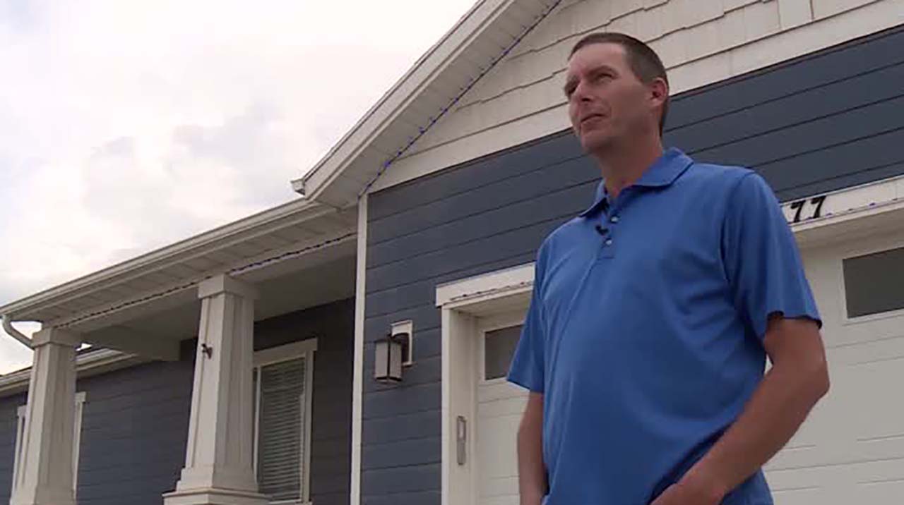 Jeff Noorda, a homeowner in the Legacy Farms neighborhood, says blue lights on his house are in honor of medical professionals fighting the COVID-19 pandemic. His HOA says he has to take the lights down, or face a $50 fine. (Photo: KSL TV)