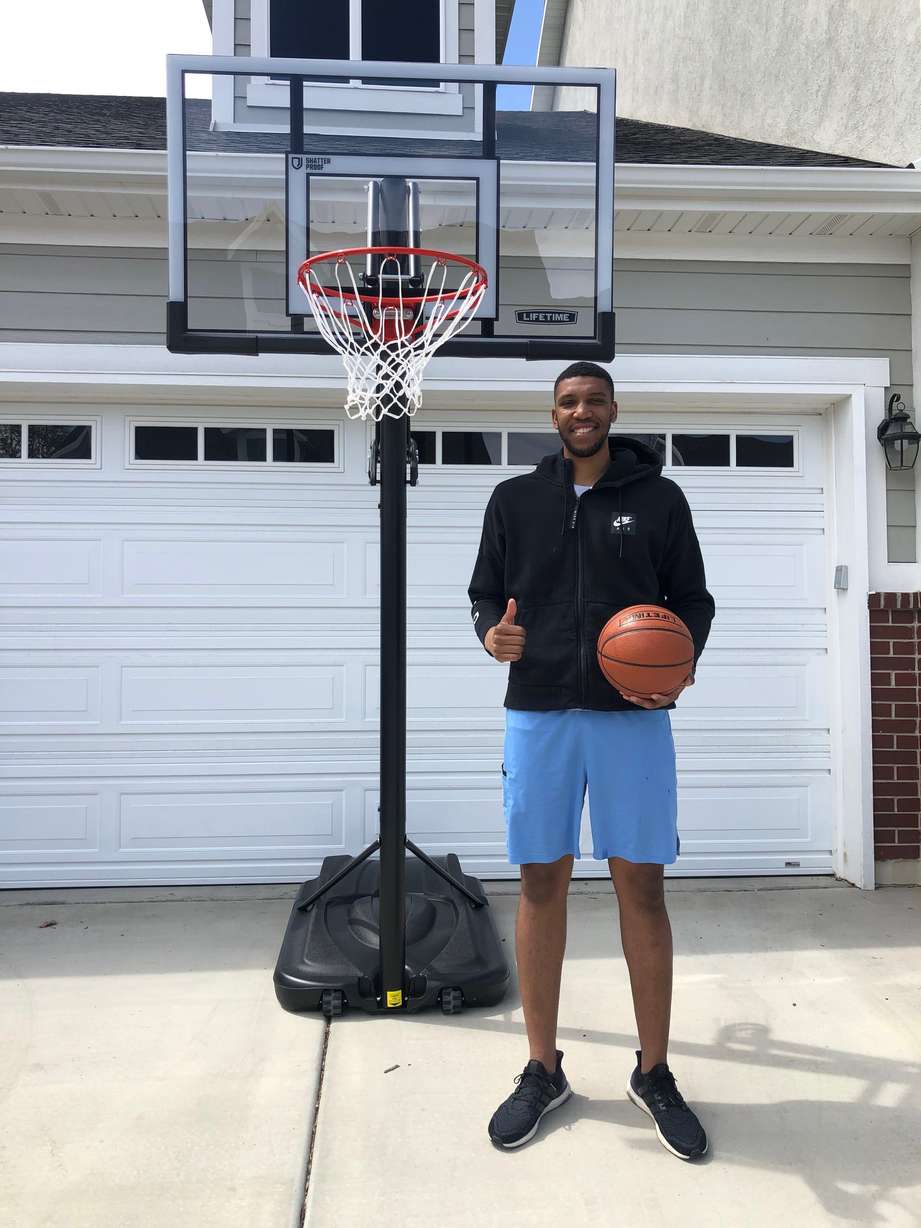 Tony Bradley poses nest to his Lifetime basketball hoop (Courtesy Landon Southwick)