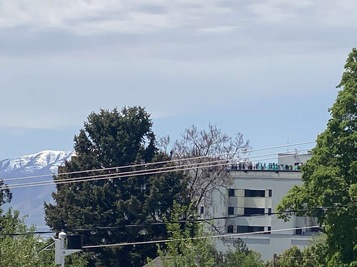 LDS Hospital staff stand on the roof of the hospital in Salt Lake City to watch Hill Air Force Base’s 388th Fighter Wing team on Thursday, April 30, 2020. (Photo: Briana Terry)