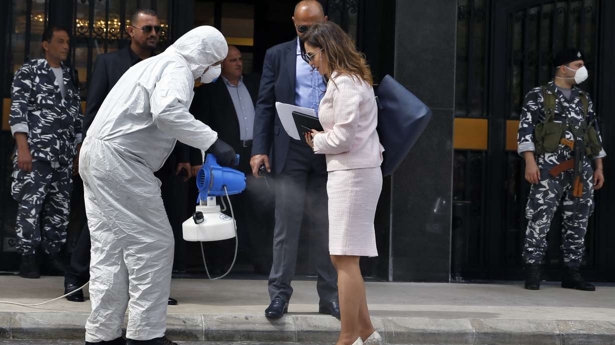 The Latest: Virus to delay regional elections in Indonesia