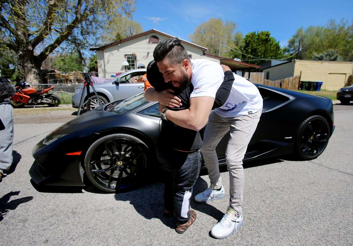 Adrian Zamarripa hugs Jeremy Neves, owner of a Lamborghini Huracan, in Ogden Tuesday, May 5, 2020. (Photo: Scott G Winterton, KSL)