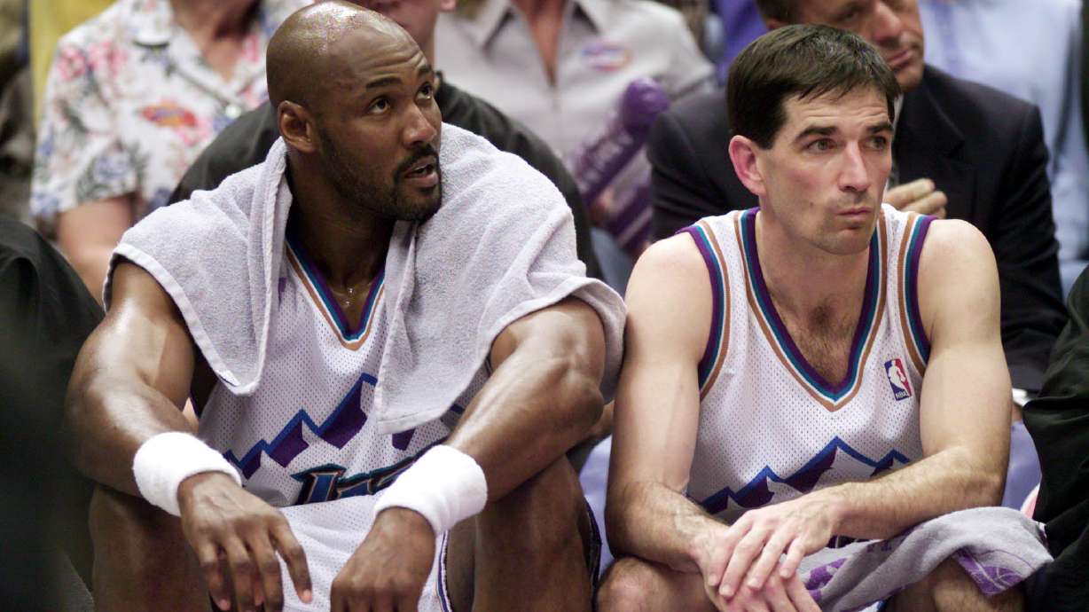 Karl Malone and John Stockton take a rest during the playoffs.