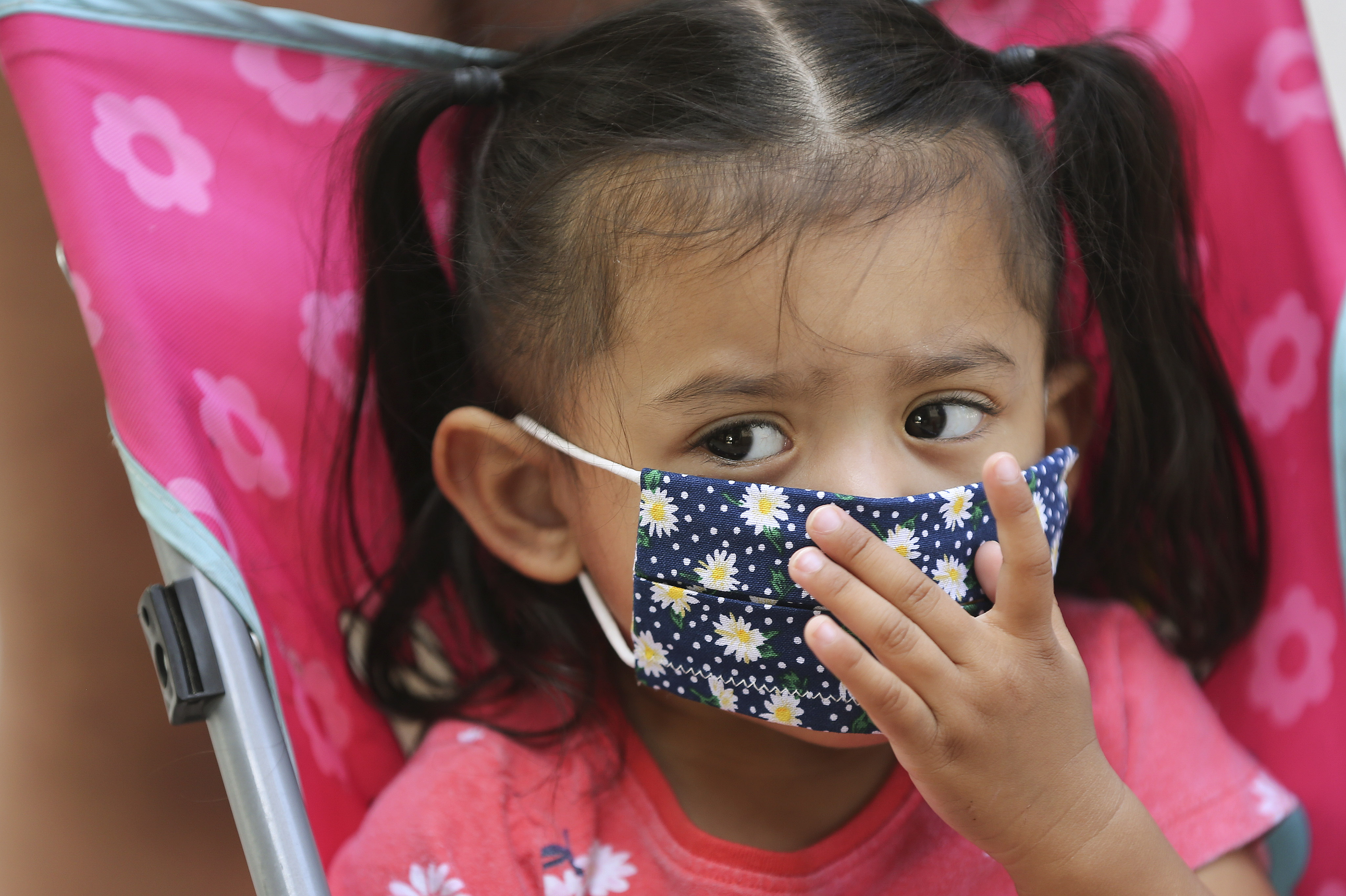 America Rodriguez adjusts her mask while shopping with her family at City Creek Center in Salt Lake City on Wednesday, May 6, 2020. The shopping center reopened Wednesday. (Jeffrey D. Allred, KSL)