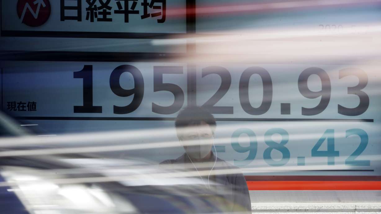 Asian shares mixed after Wall St dips on pandemic worries