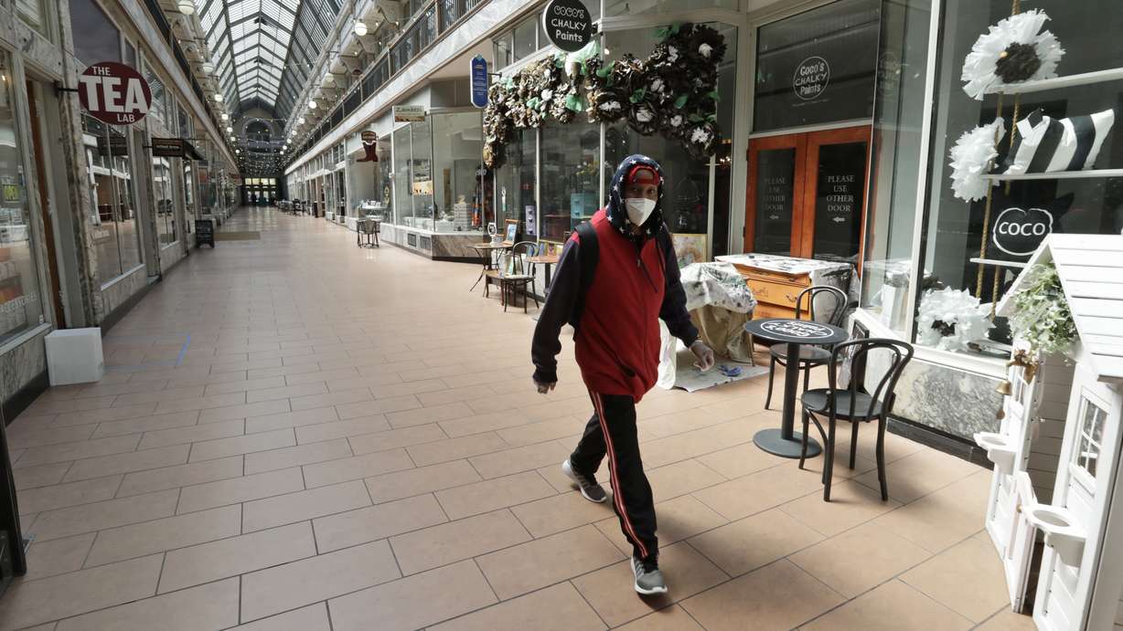 A man walks through the 5th Street Arcade, a selection of indoor shops closed during the pandemic, Thursday, May 7, 2020, in Cleveland. (Photo: Tony Dejak, AP Photo)