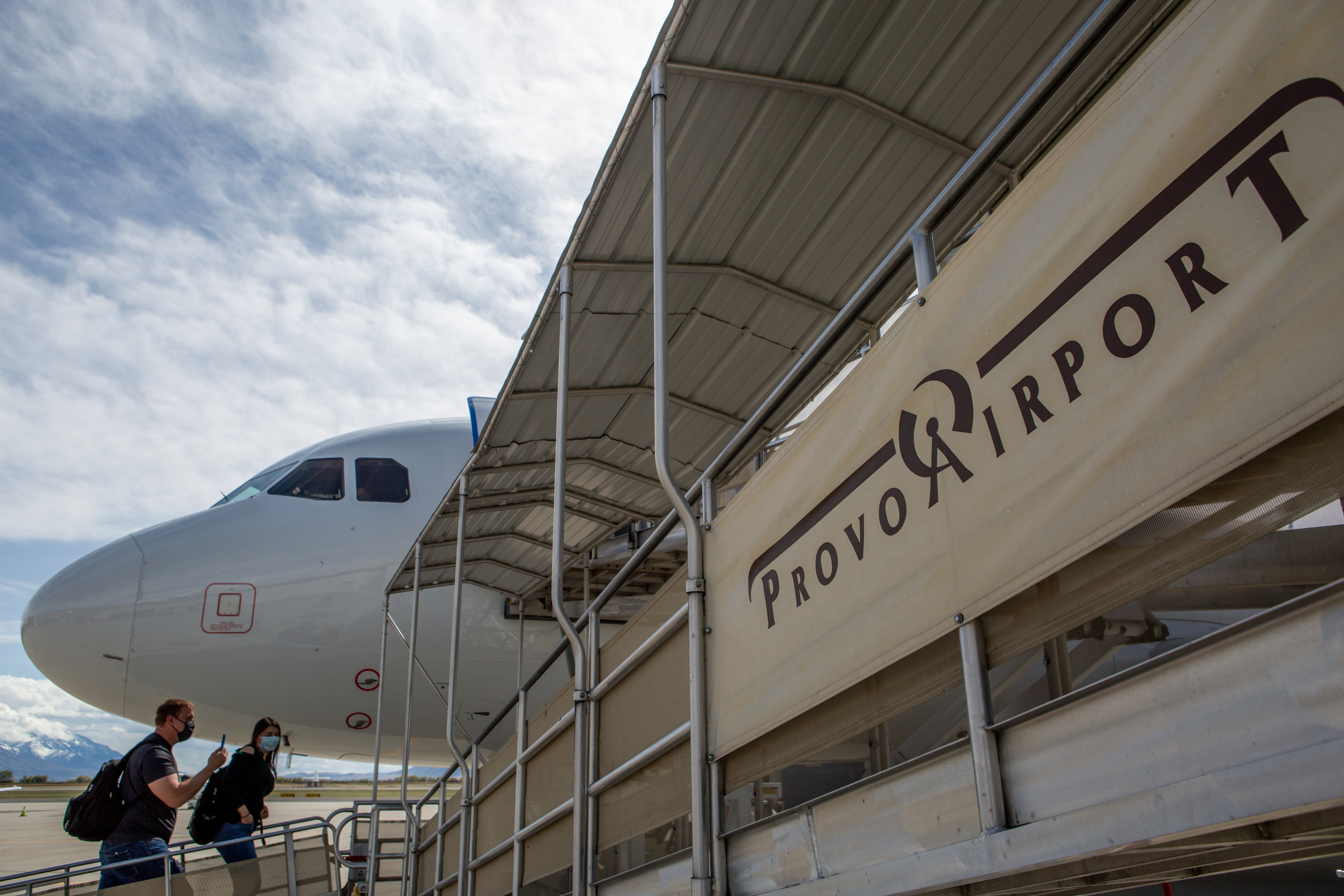 Passengers board a flight while wearing masks amid the coronavirus pandemic at the Provo Airport on Thursday, April 23, 2020. (Ivy Ceballo, KSL)