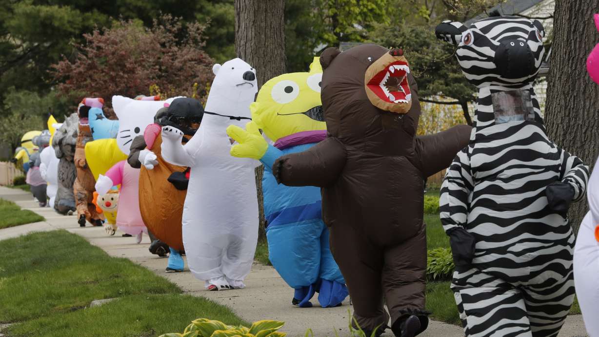 Detroit-area residents lift spirits with costumed parades