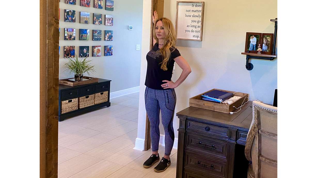 This stretch provides relief of tension in your chest muscles and the front of your shoulders that come from slumping in a seated position. (Photo: Courtesy of Dana Santas)