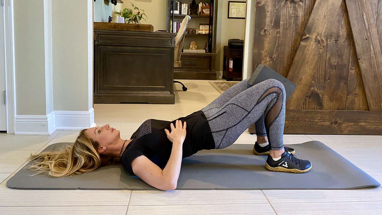 This positional breathing exercise strengthens your diaphragm, core and glutes while releasing your hip flexors to establish an optimal rib cage and pelvis position for better overall posture. (Photo: Courtesy of Dana Santas)