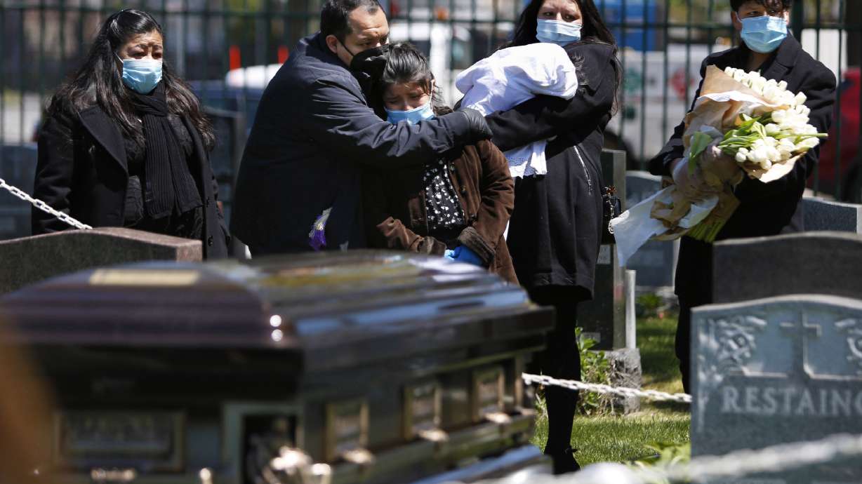 Young priest loses mentor, then his father -- both to virus