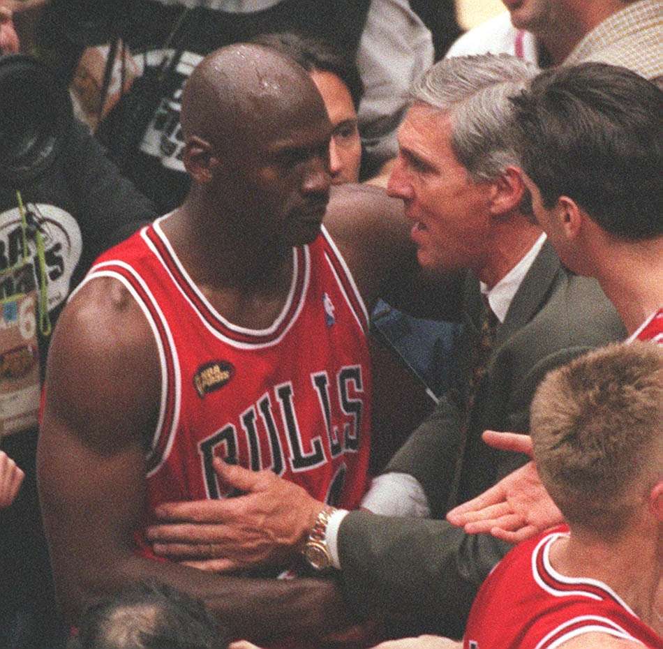Jazz coach Jerry Sloan congratulates Michael Jordan after the Bulls won their third-straight title after Game 6 of the NBA Finals at the Delta Center, June 14, 1998. (Photo: Chuck Wing, Deseret News archives)