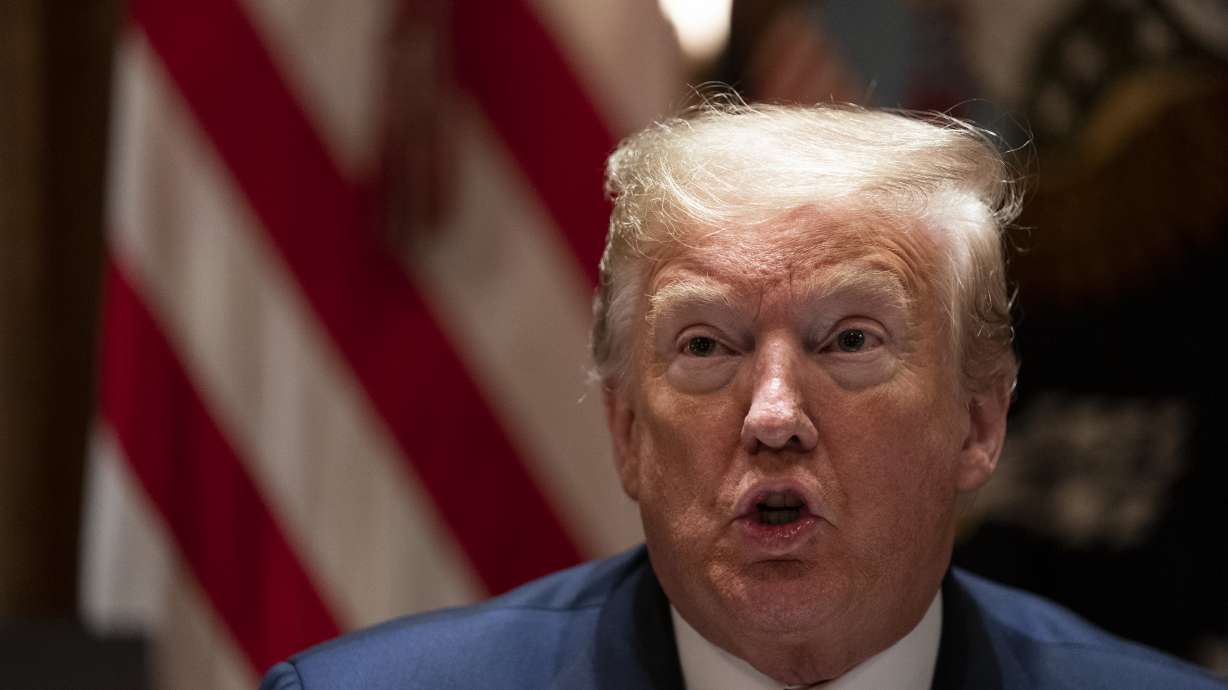 Pandemic politics: Maskless Trump tours Michigan Ford plant