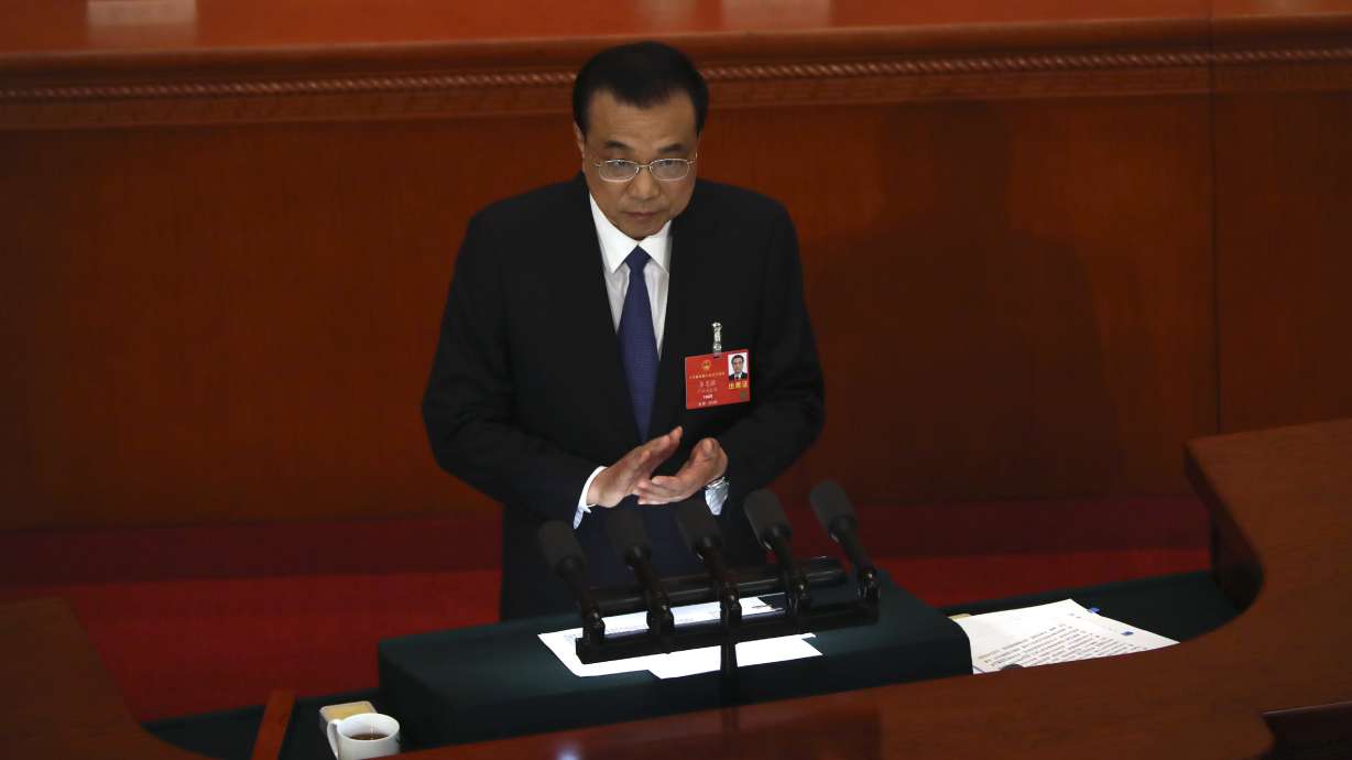 China boosts spending for virus-hit economy, takes up HK law