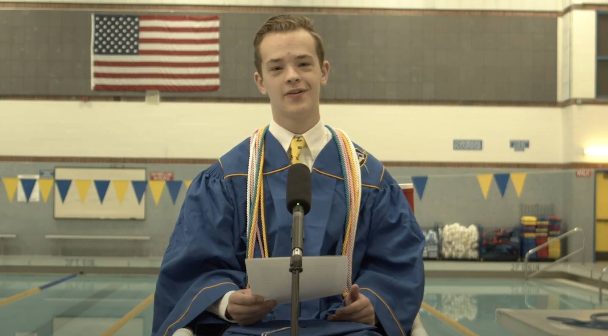 Taylorsville High valedictorian Ian Moore films his commence speech at the school's pool as part of the district's online virtual graduation ceremonies due to the COVID-19 pandemic. Moore, who will swim with the University of Utah's collegiate master's program this fall, and his classmates have had to adjust their senior years because of the pandemic. (Courtesy: Taylorsville High School)