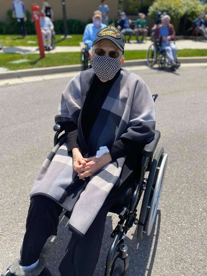 Noma Kjar, a resident at the William E. Christoffersen Salt Lake Veterans Home, watches the Salute Utah Flyover on April 30, 2020. Kjar served in the Women's Army Corp during World War II. (VA Salt Lake City Healthcare)