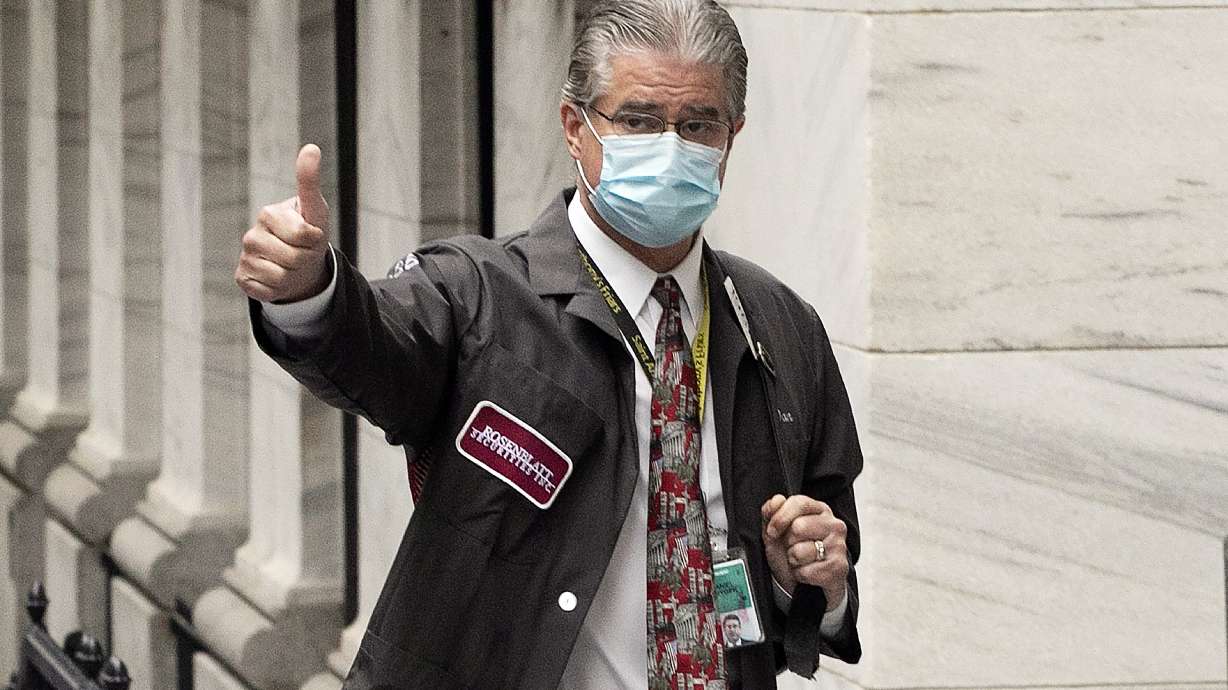 Bell rings but trading floor chaos subdued as NYSE reopens