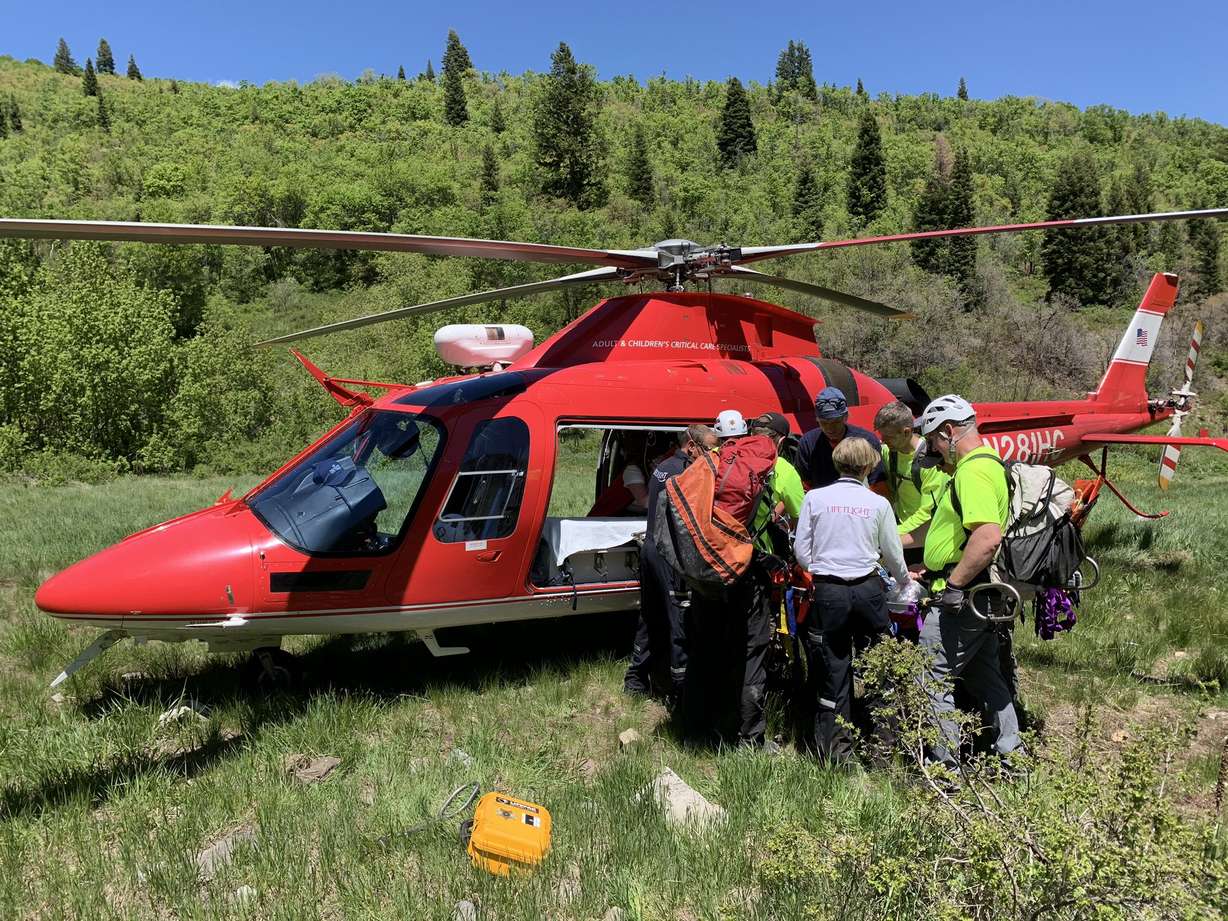 Utah County Search and Rescue members help place a 9-year-old boy into a medical helicopter after he fell at Stewart Falls in Provo Canyon on Monday, May 25, 2020. (Photo: Utah County Sheriff's Office)