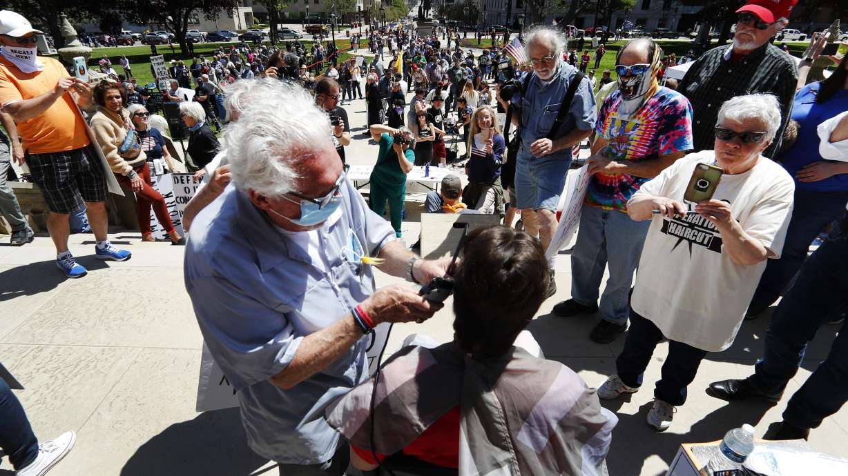 Official says defiant Michigan barbershop is health threat