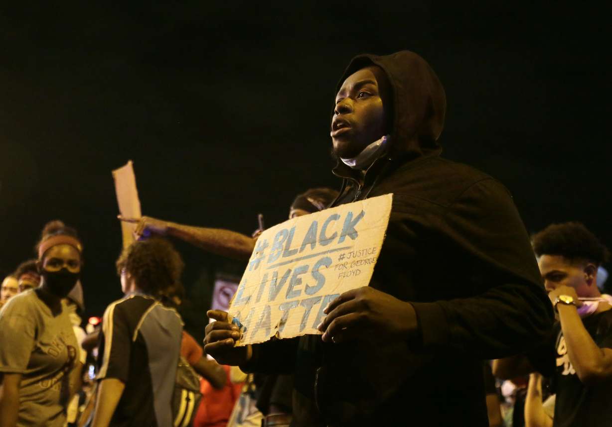 A protester holds a sign in downtown Columbus, Ohio, Thursday, May 28, 2020, during a demonstration over the death of George Floyd in police custody Monday in Minneapolis. (Photo: Barbara J. Perenic/The Columbus Dispatch via AP)