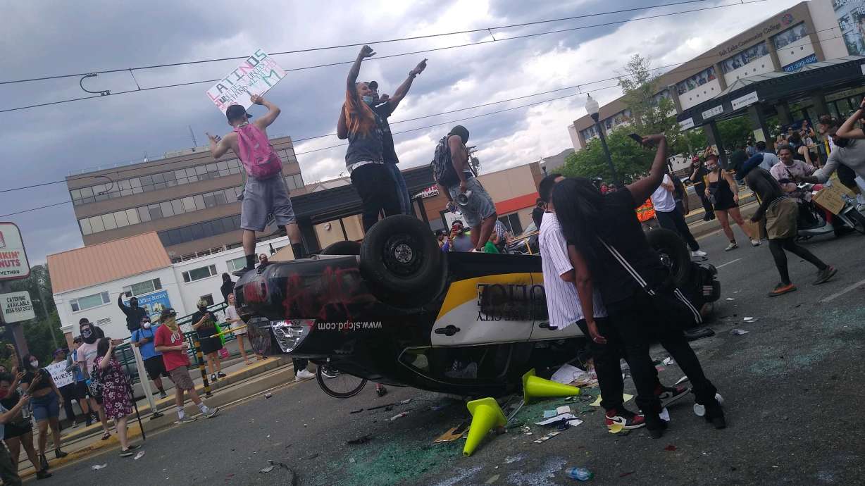 4th person arrested in destruction of Salt Lake police car