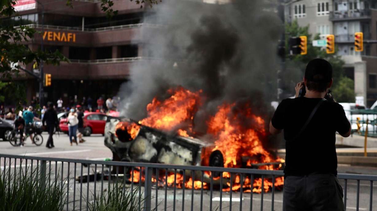 A Salt Lake police patrol car was set on fire at the corner of 200 East and 400 South on May 30, 2020, amid protests calling for justice in the death of George Floyd. A Salt Lake man admitted in federal court this week to throwing a burning cloth into the overturned car during the protest.