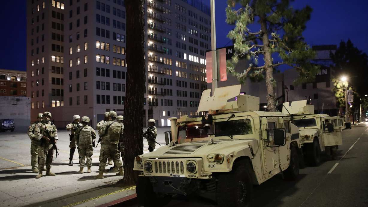 The Latest: Police say 4 officers shot in St. Louis protests