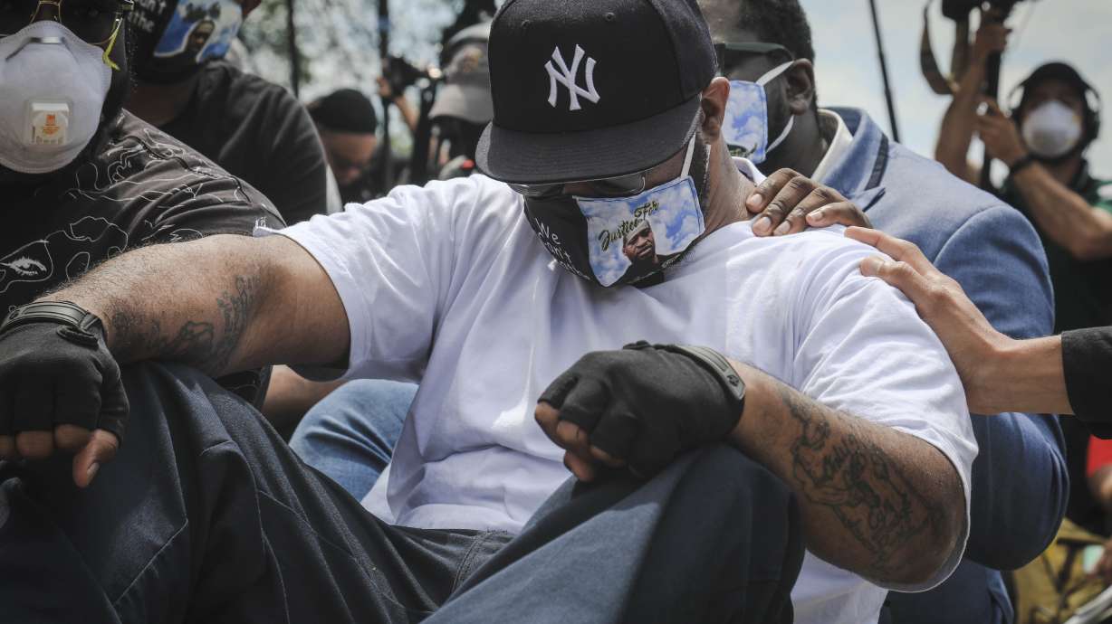 On the spot where George Floyd died, his brother urges calm