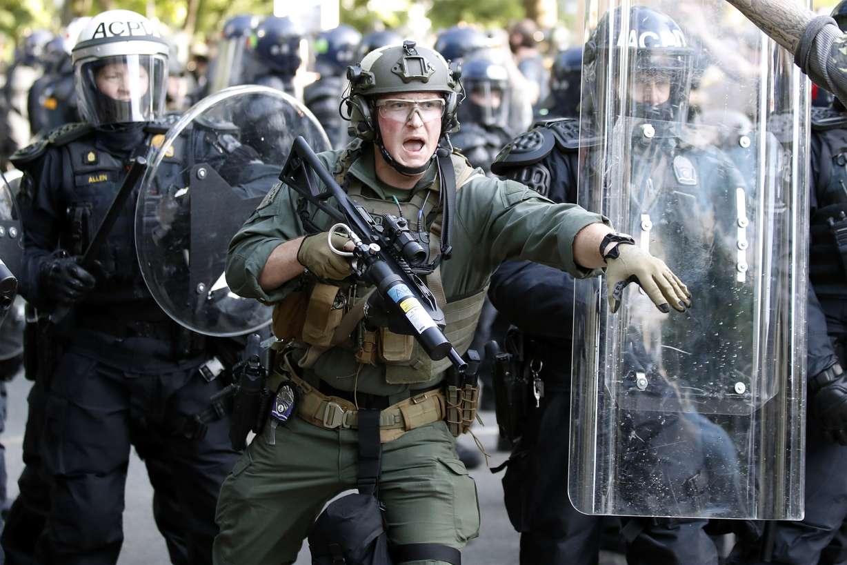 Police begin to clear demonstrators gathered as they protest the death of George Floyd, Monday, June 1, 2020, near the White House in Washington. Floyd died after being restrained by Minneapolis police officers. (Alex Brandon, AP Photo)