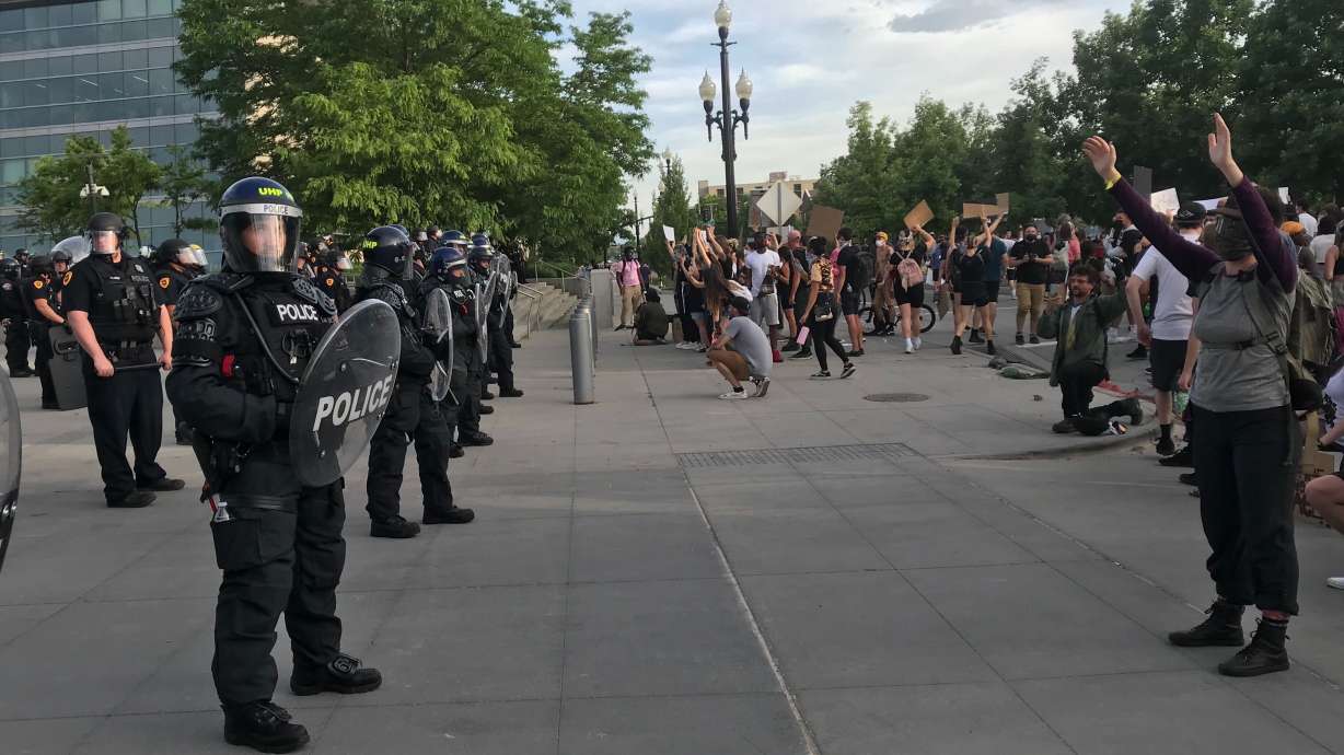 After tense weekend, hundreds gather for peaceful protest in Salt Lake