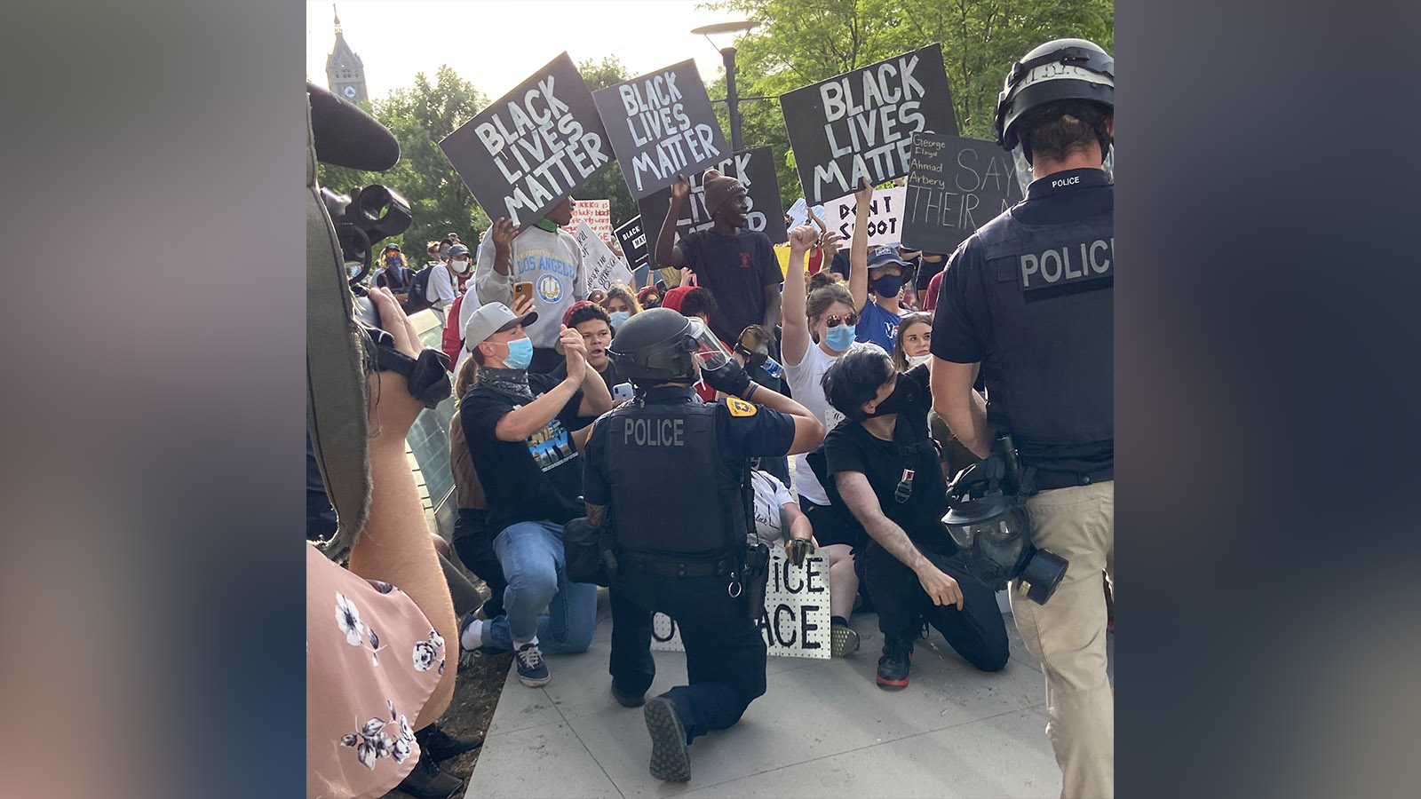 A Salt Lake City police officer kneels with protesters at Washington Square Park Monday, June 1, 2020. Organizers PSL Salt Lake said they wanted to stand “in solidarity with” the people of Minneapolis and across the nation protesting George Floyd's killing and other injustices against racial minorities.(Photo: Graham Dudley, KSL.com)