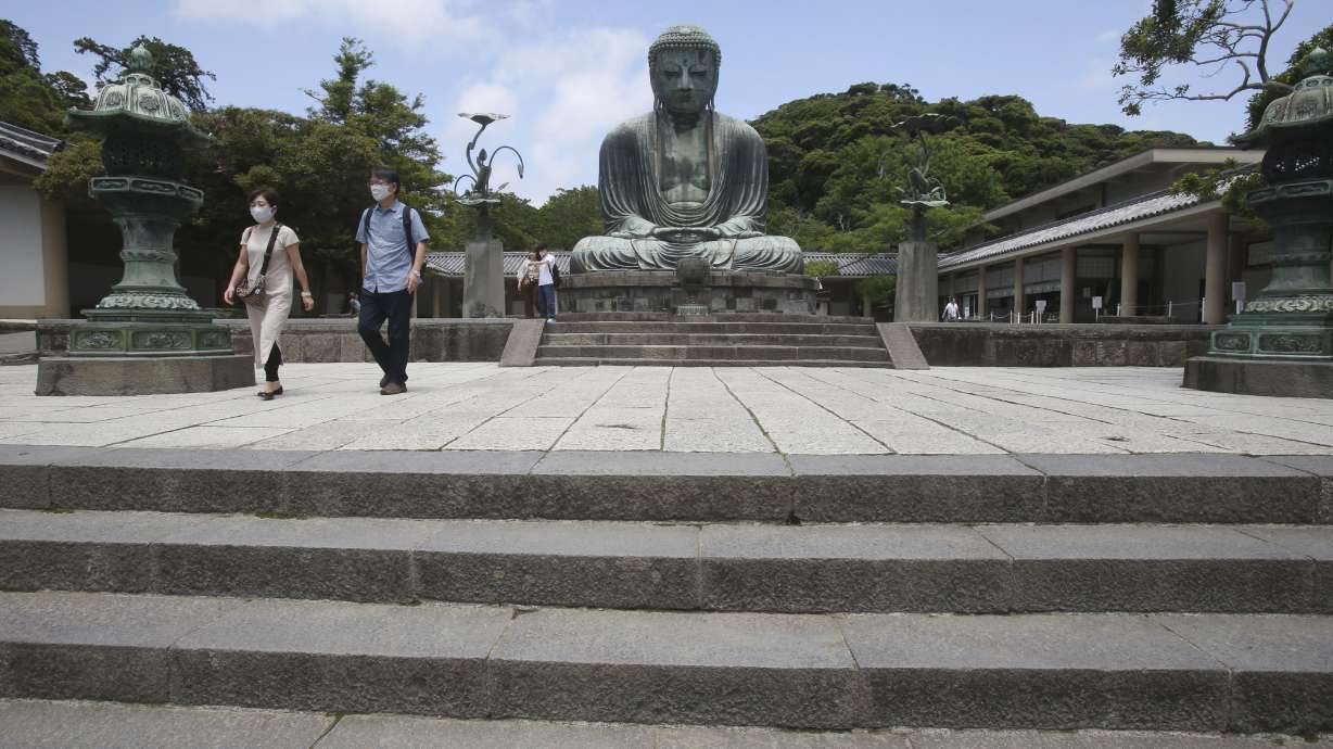 The Latest: UN body calls for action on debt amid pandemic