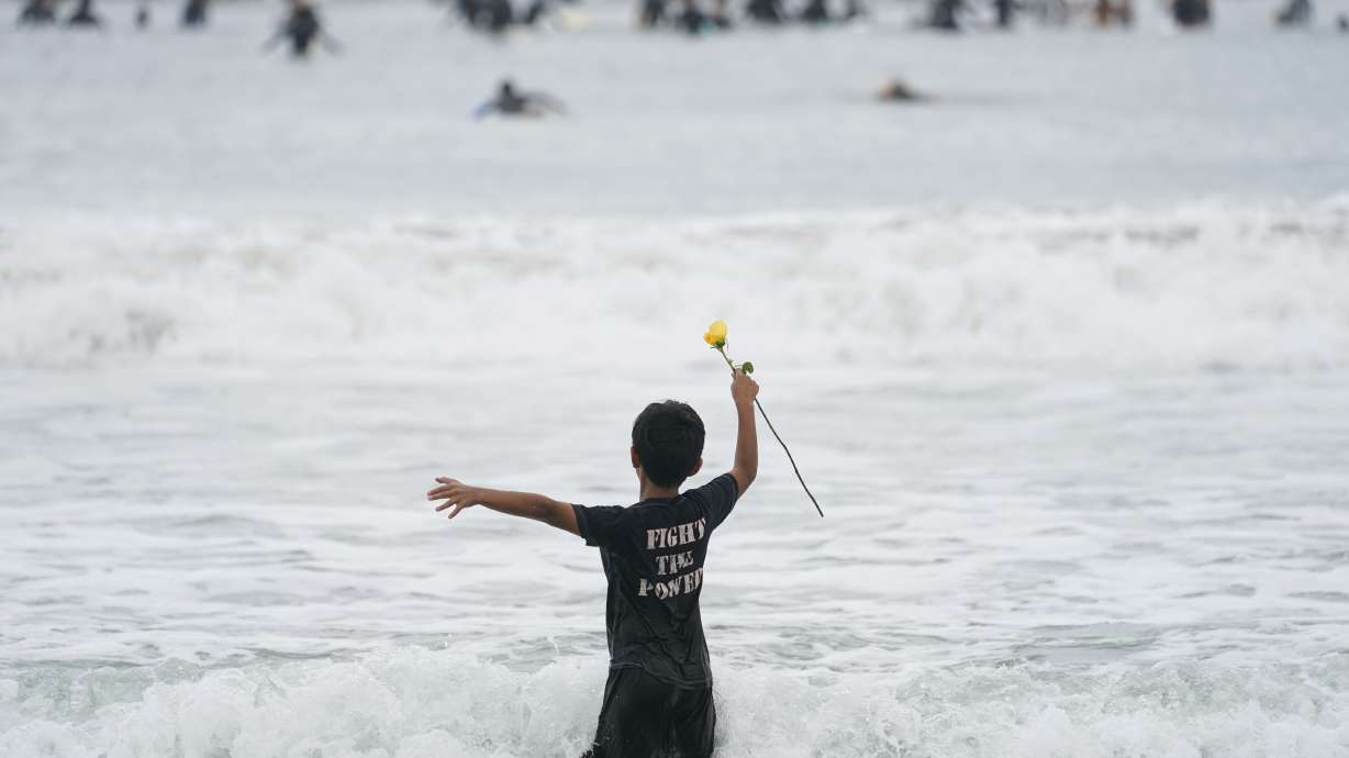 Surfers 'paddle out,' circle up in memory of George Floyd