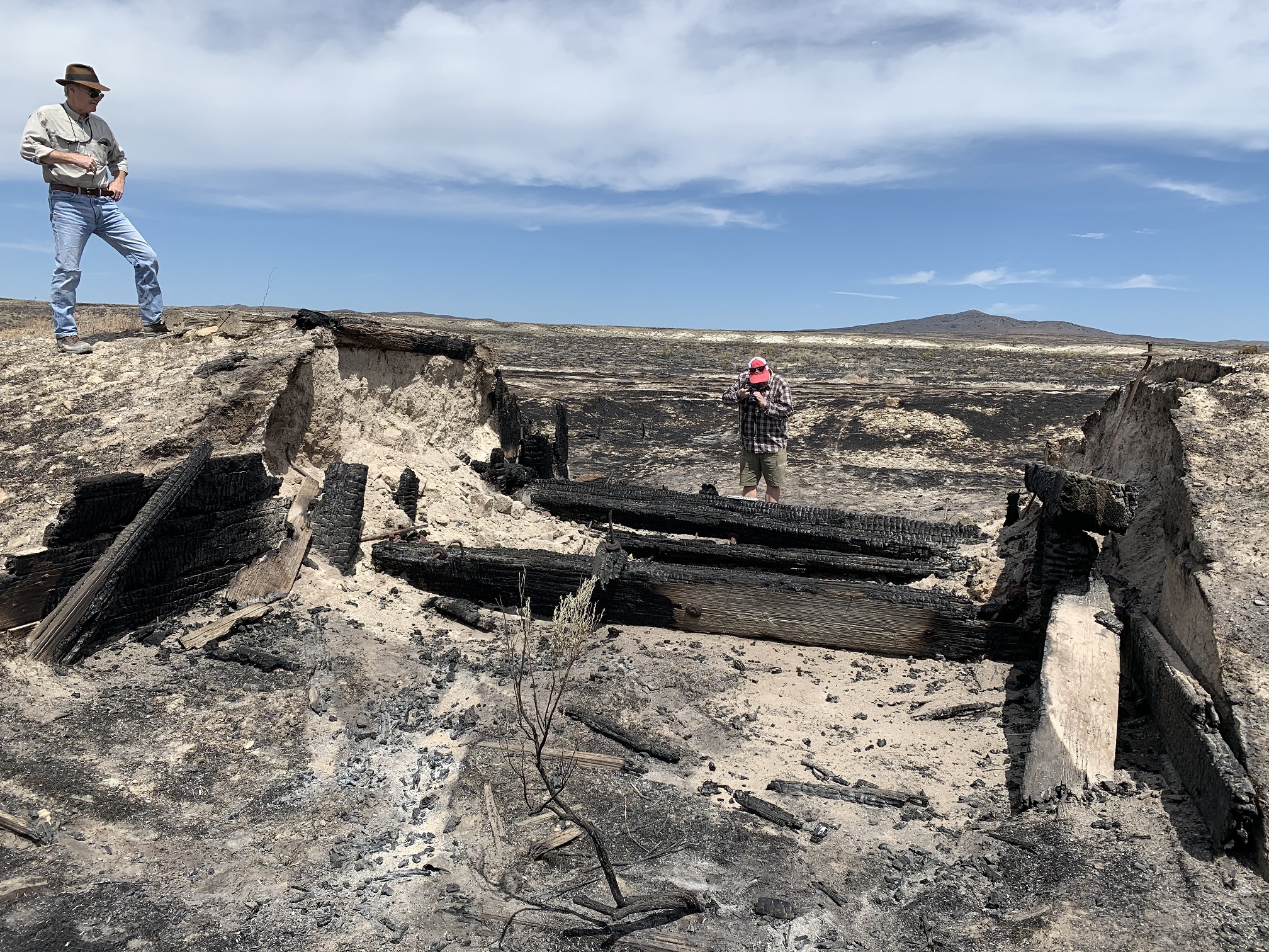 Archaeologists inspect damaged transcontinental railroad artifacts on Friday, June 5, 2020. The pieces of Utah history were destroyed by the 8,000-acre Matlin Fire. (Photo: Utah Division of State History)