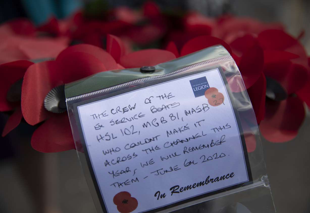 A poppy wreath with a message, for a group who could not attend D-Day remembrances, prior to being laid by British expatriate Steven Oldrid during D-Day ceremonies in Benouville, Normandy, France on Saturday, June 6, 2020. Due to coronavirus measures many relatives and veterans will not make this years 76th anniversary of D-Day. Oldrid will be bringing it to them virtually as he places wreaths and crosses for families and posts the moments on his facebook page. (Photo: Virginia Mayo, AP Photo)