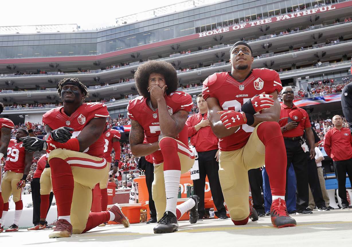 In this Oct. 2, 2016, file photo, from left, San Francisco 49ers outside linebacker Eli Harold, quarterback Colin Kaepernick and safety Eric Reid kneel during the national anthem before an NFL football game against the Dallas Cowboys in Santa Clara, Calif. When Colin Kaepernick took a knee during the national anthem to take a stand against police brutality, racial injustice and social inequality, he was vilified by people who considered it an offense against the country, the flag and the military. Nearly four years later, it seems more people are starting to side with Kaepernick’s peaceful protest and now are calling out those who don’t understand the intent behind his action. (Photo: Marcio Jose Sanchez, AP Photo, File)