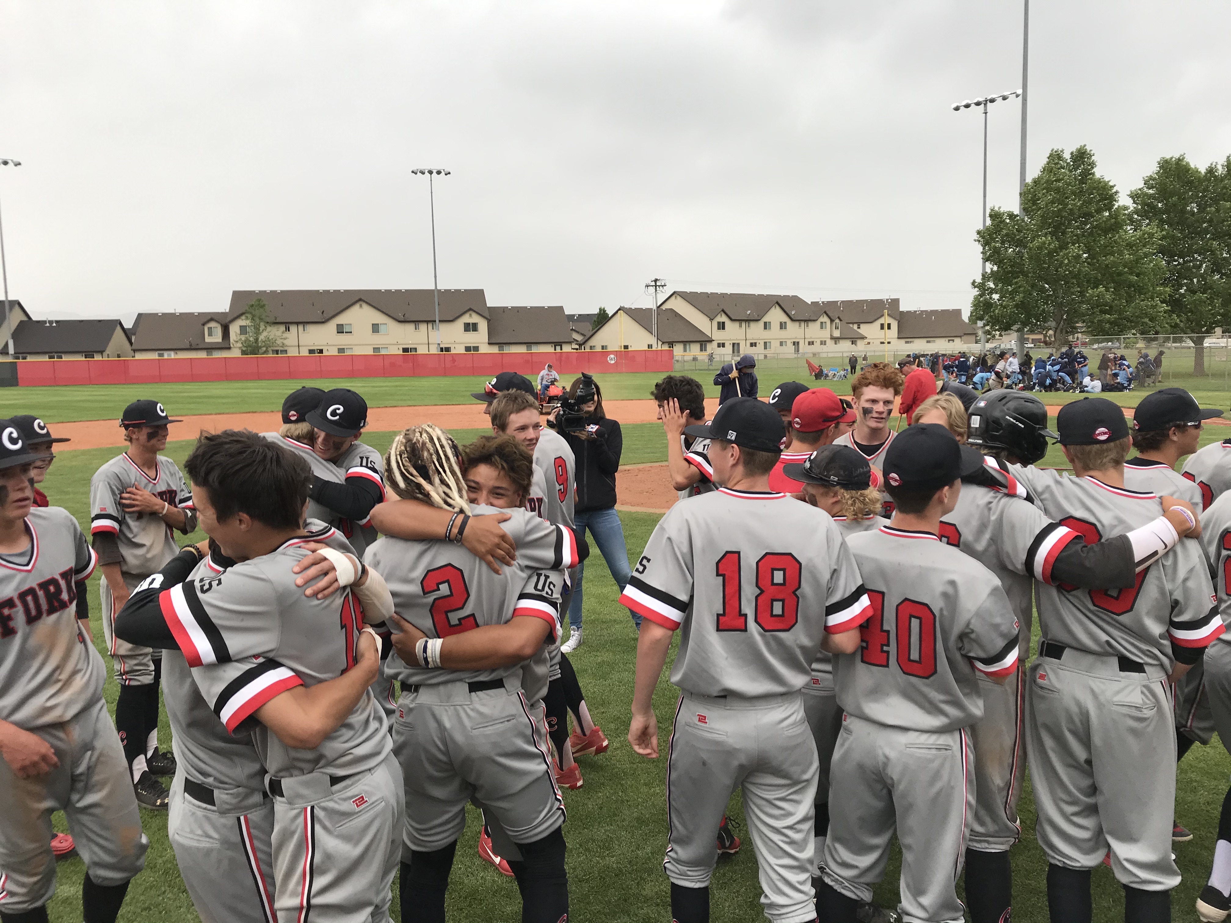 Jack Walker (2) hugs his teammates after American Fork rallied for an 8-7 win over Riverton in the Class 6A championship game of the UPG Last Chance tournament, Saturday, June 6, 2020 in Spanish Fork. (Photo: Sean Walker, KSL.com)