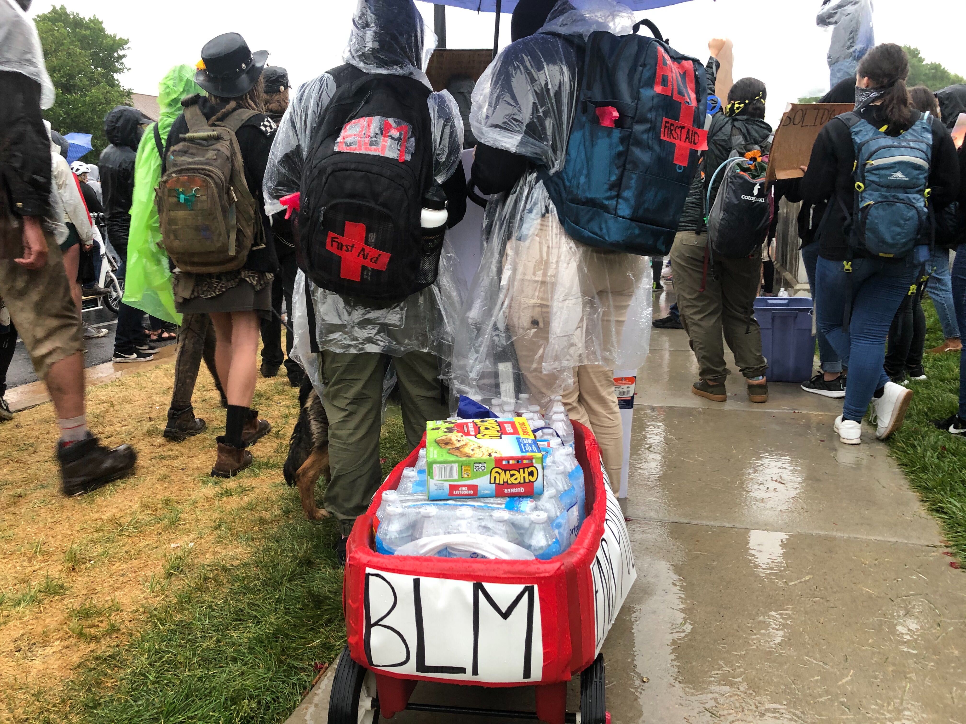 Tiffany and Sara pull a wagon filled with granola and bottles of water on Saturday, June 6, 2020. Protesters made their way from the Capitol through the streets of Salt Lake to honor the lives of Bernardo Palacios-Carbajal and Breonna Taylor. (Photo: Whitney Evans, KSL.com)