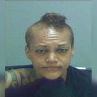 Police arrest woman accused of urinating on overturned Salt Lake patrol car during riot