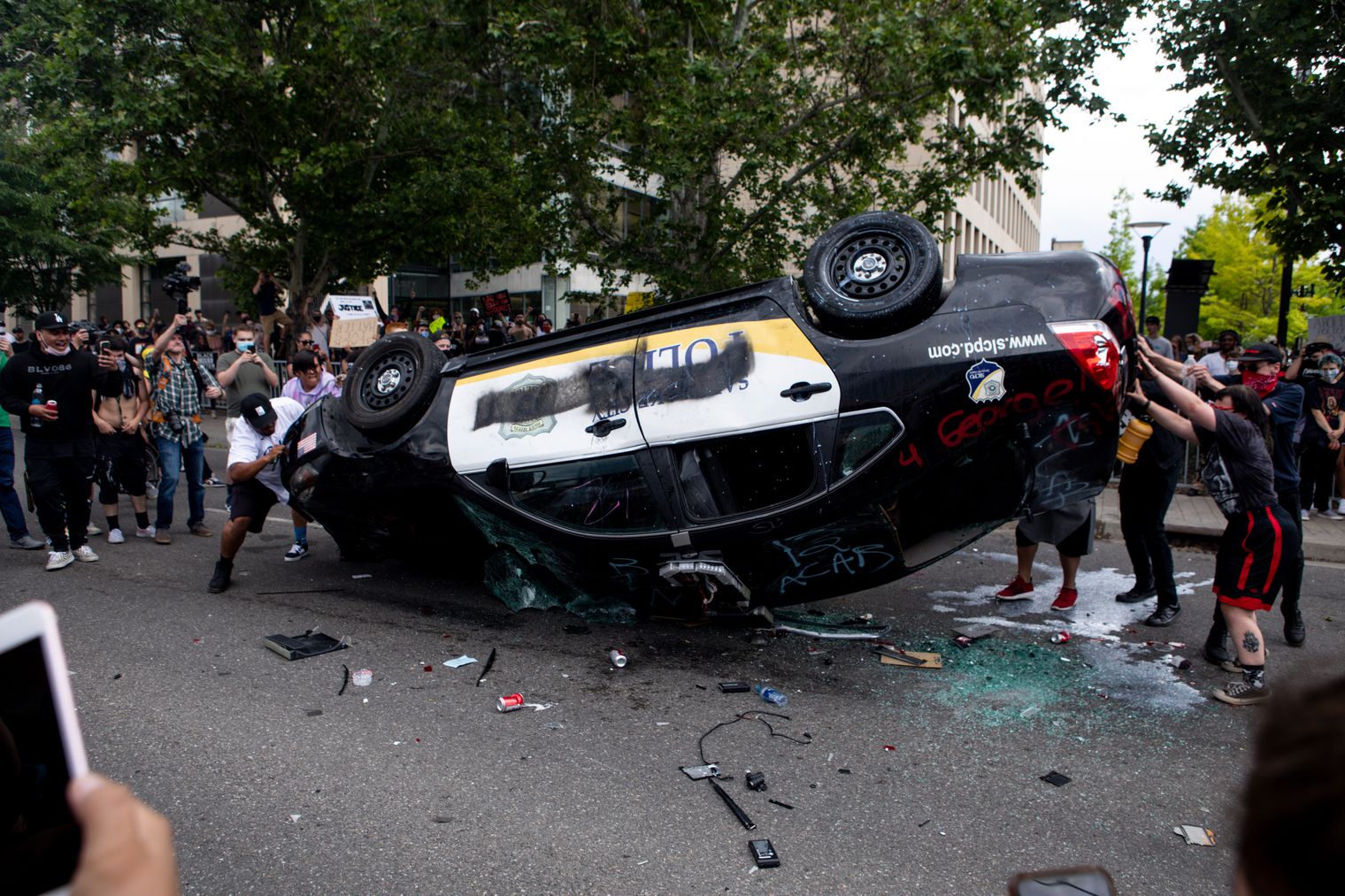 Probation, community service ordered for 2 who overturned police car in riot