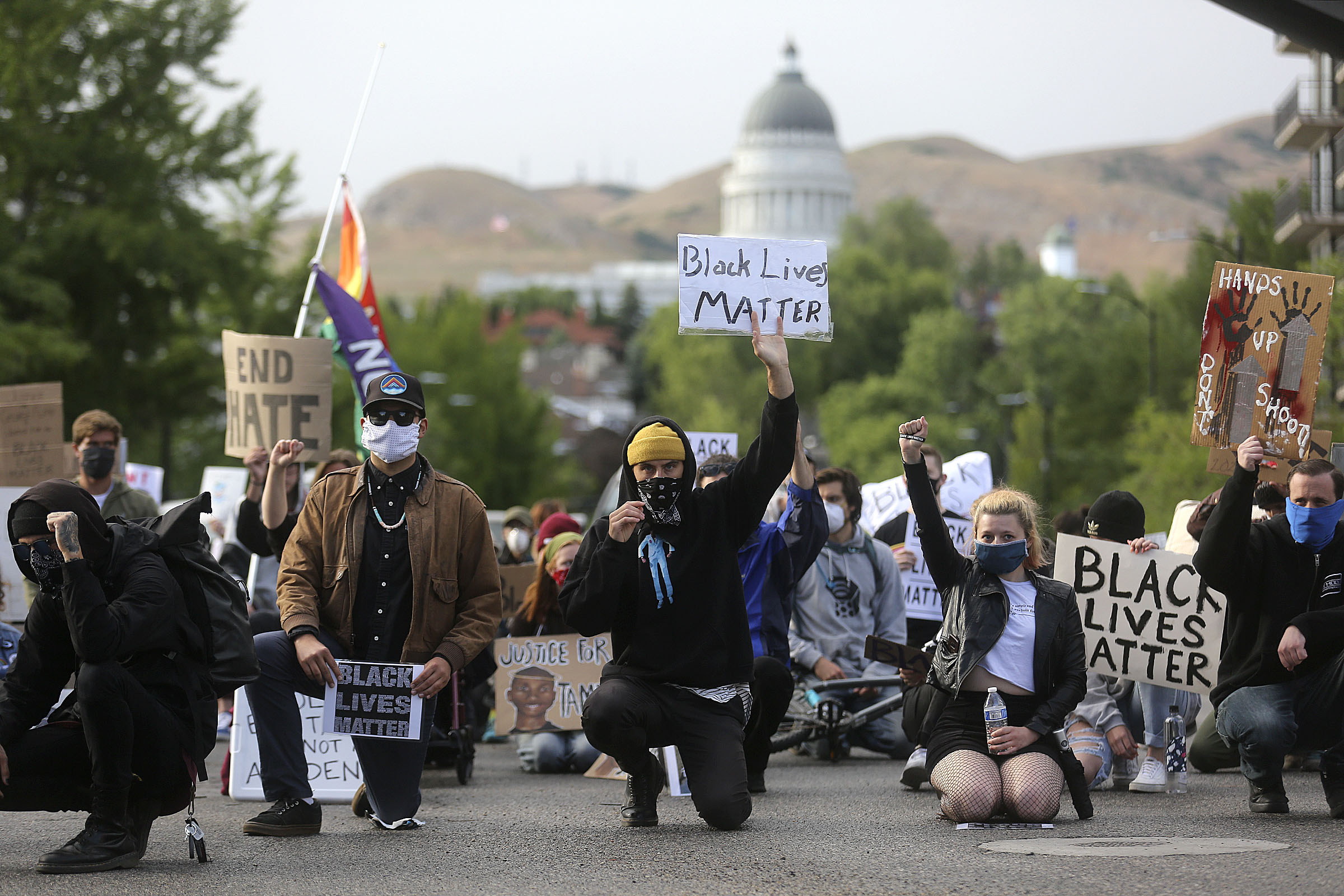Protesters take a knee at the intersection of State Street and South Temple to honor those who have been killed as a result of police brutality and to protest racism in Salt Lake City on Monday, June 8, 2020. (Photo: Kristin Murphy, KSL)
