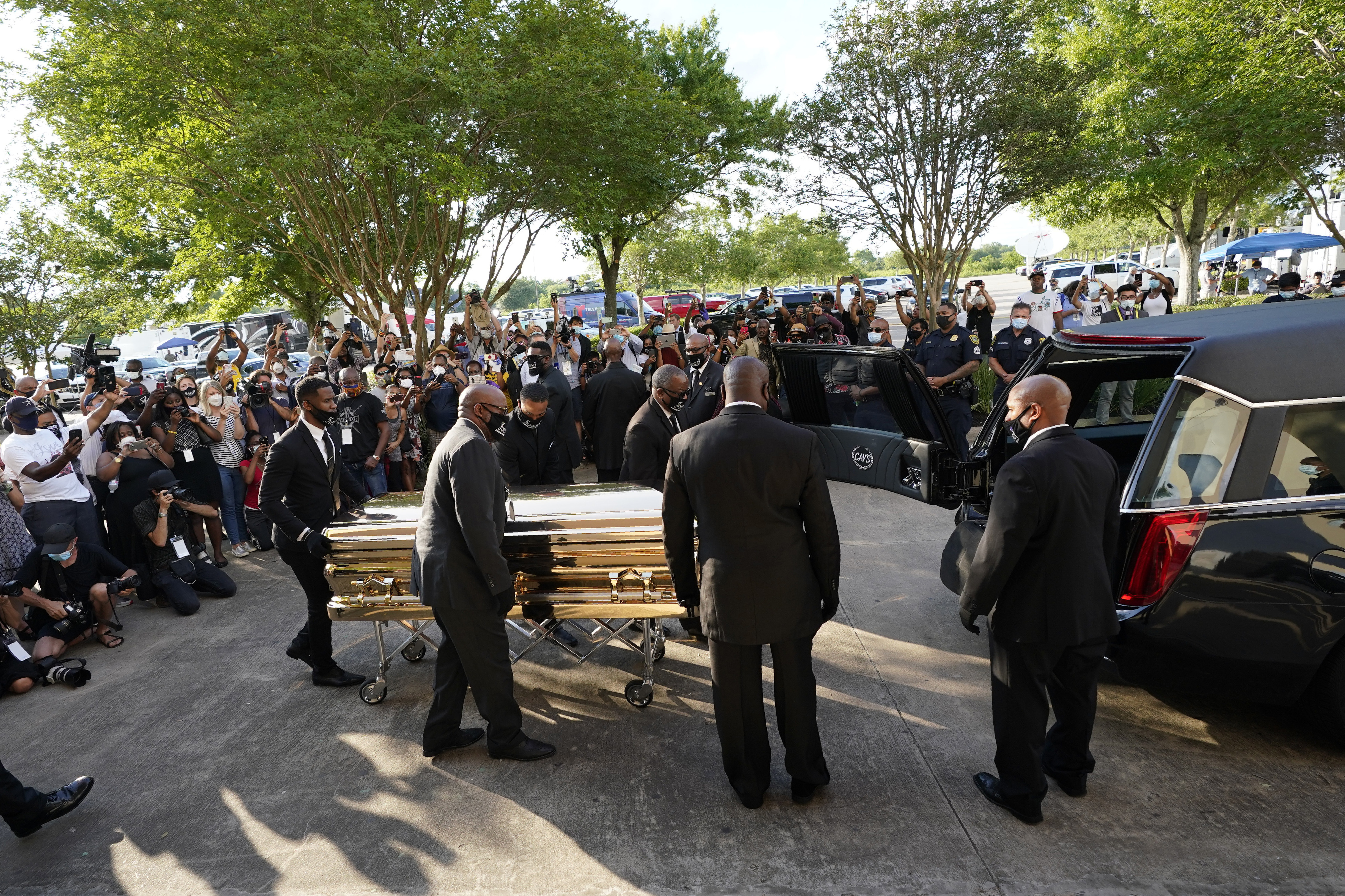 The Latest: George Floyd's casket taken inside mausoleum