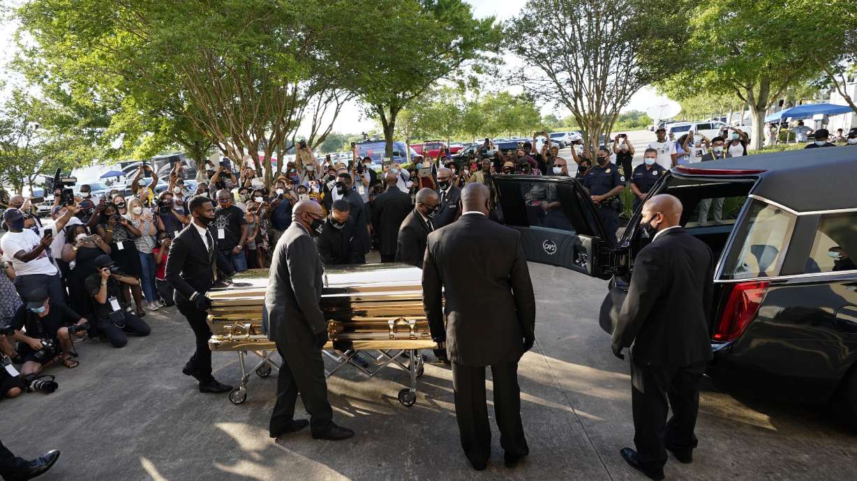 The Latest: George Floyd's casket taken inside mausoleum