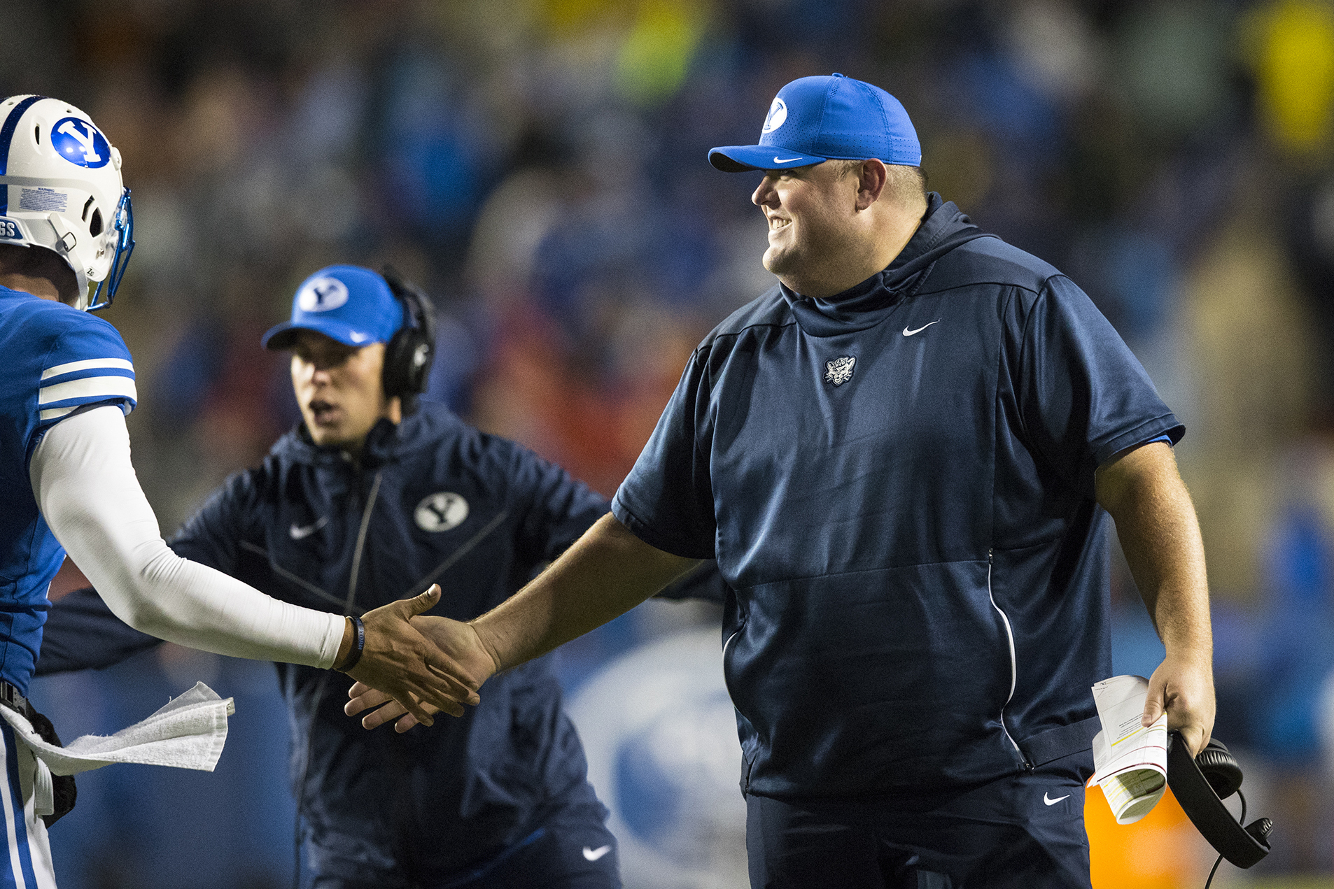 BYU offensive line coach Eric Mateos on the sidelines during BYU’s win over nationally ranked Boise State on Oct. 19, 2019.