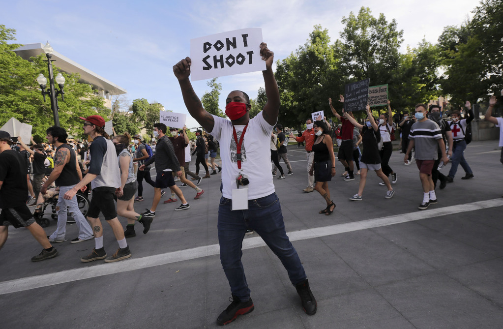 Monte McElory holds a “Don't Shoot” sign as he marches to the Salt Lake Public Safety Building in Salt Lake City on Monday, June 1, 2020. (Photo: Spenser Heaps, KSL)