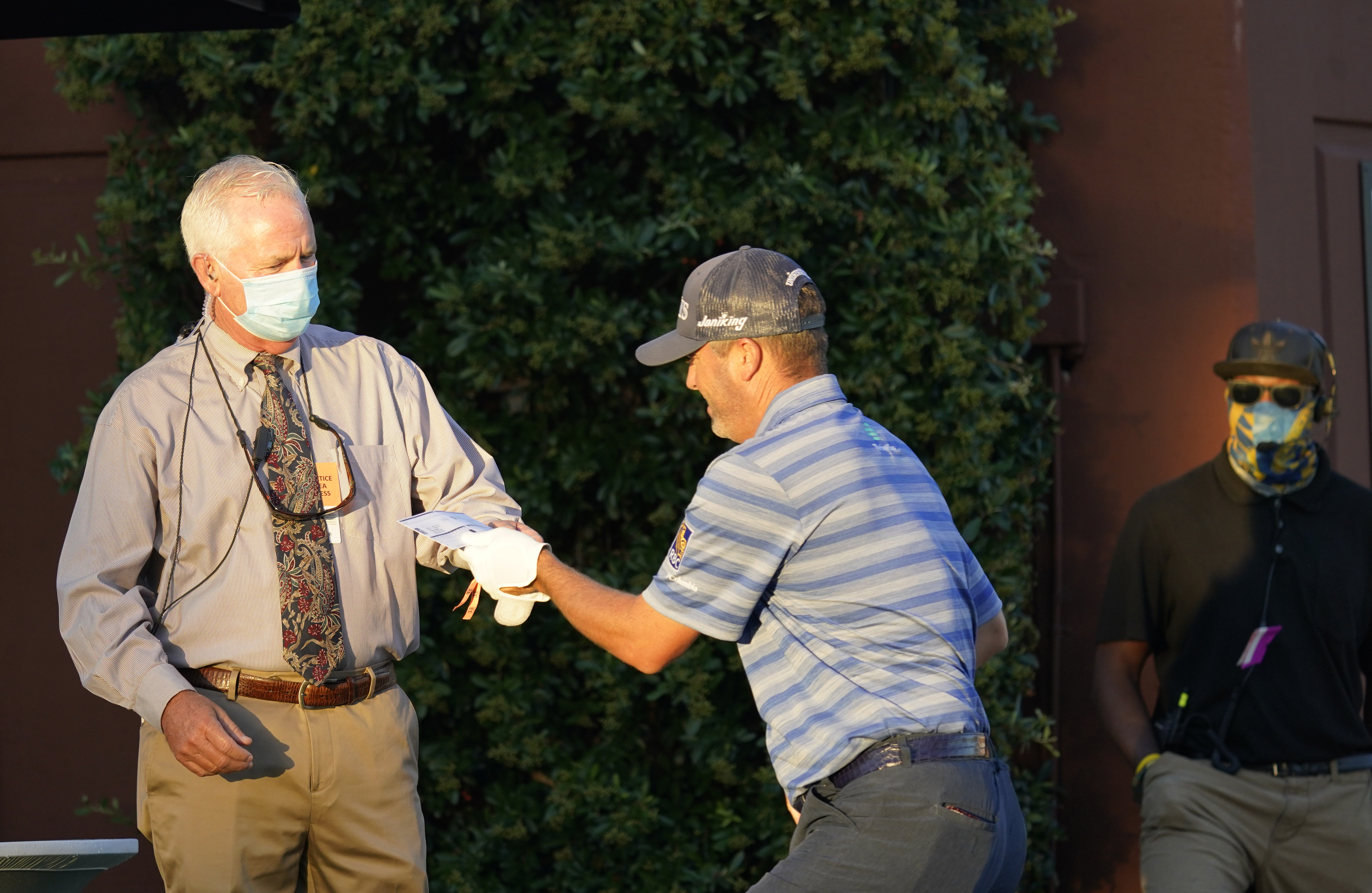 With a swing and silence, PGA Tour gets back to business