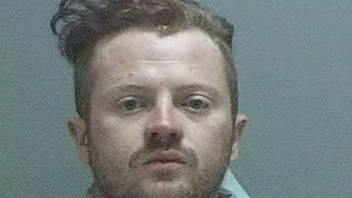 Salt Lake man charged with burning police car during riot to remain in jail